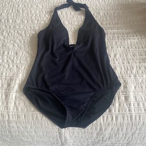 Mid back and low cut front women’s one piece bathing suit